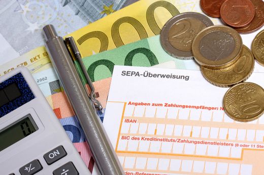 Foto: Erlagschein und Münzen